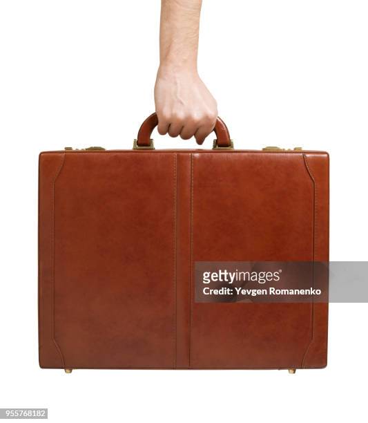 brown leather briefcase in hand - leather bag stock pictures, royalty-free photos & images