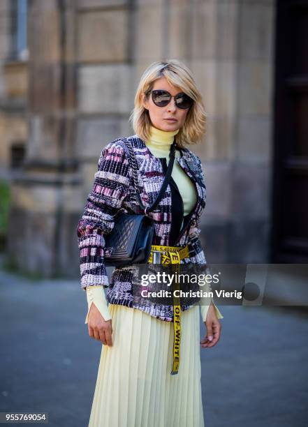 Gitta Banko wearing a tweed jacket by AirField, light-yellow turtleneck sweater from Zara, yellow pleated skirt from Mango, yellow belt by Off-White,...