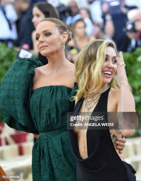 Stella Mccartney and Miley Cyrus arrive for the 2018 Met Gala on May 7 at the Metropolitan Museum of Art in New York. - The Gala raises money for the...