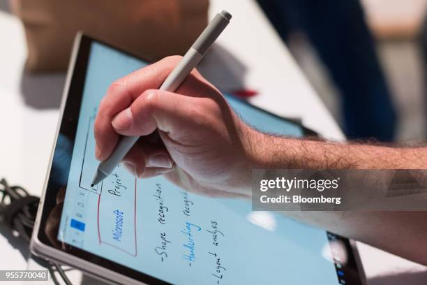 An attendee demonstrators the handwriting recognition tool on a Microsoft Corp. Surface Pro 2 laptop computer at the Microsoft Developers Build...