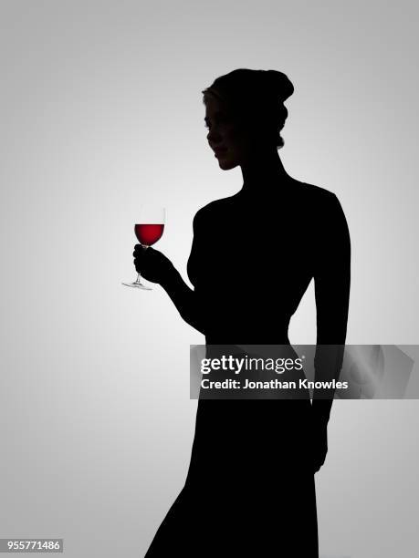 silhouette of female holding wine - contour stock pictures, royalty-free photos & images