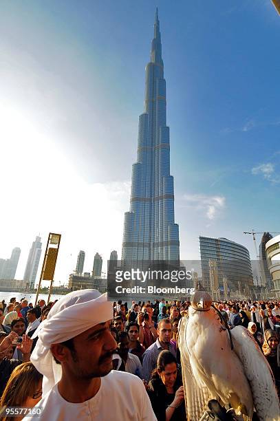 Man with a falcon attends the opening ceremony for the 200-story Burj Khalifa building in Dubai, United Arab Emirates, on Monday, Jan. 4, 2010....