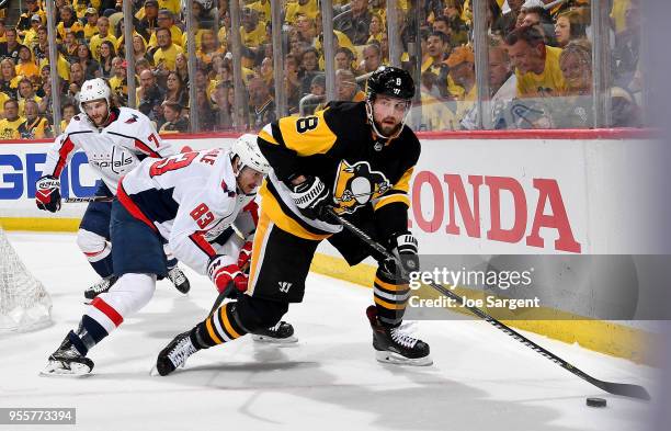 Brian Dumoulin of the Pittsburgh Penguins handles the puck against the Washington Capitals in Game Six of the Eastern Conference Second Round during...