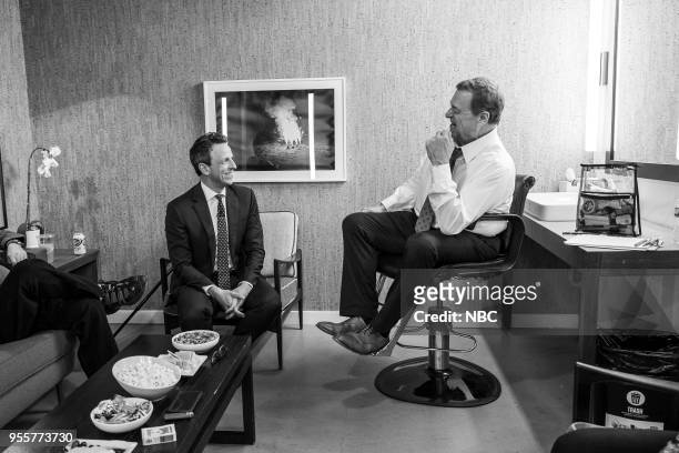 Episode 682 -- Pictured: Host Seth Meyers talks with actor John Goodman backstage on May 7, 2018 --