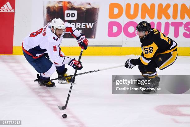 Washington Capitals Left Wing Alex Ovechkin skates with the puck around Pittsburgh Penguins defenseman Kris Letang during the second period in Game...