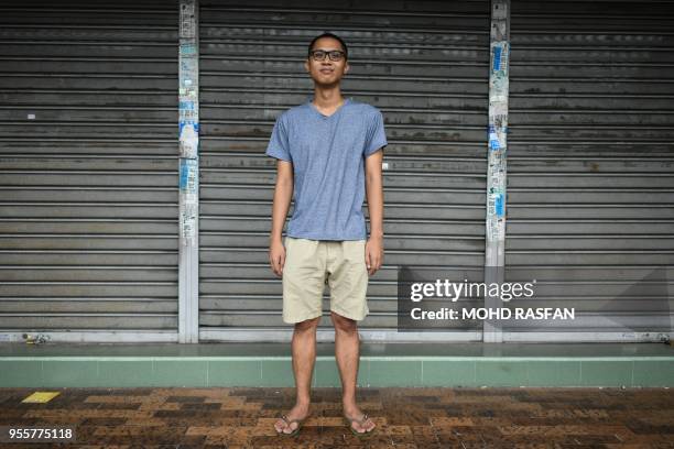 This picture taken on May 3, 2018 shows Malaysian ethnic Kadazan-Dusun from the state of Sabah on Borneo island, Ariff Kamil a freelance writer,...