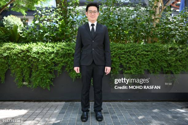 This picture taken on May 3, 2018 shows Malaysian ethnic Chinese from the state of Sarawak on Borneo island, Derrick Moh a lawyer, posing for...