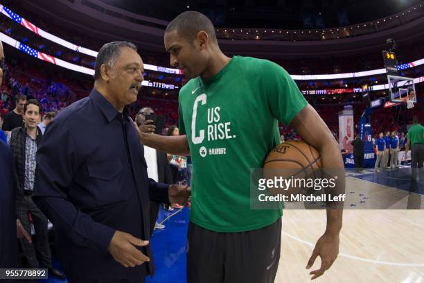 Reverend Jesse Jackson talks to Al Horford of the Boston Celtics prior to Game Four of the Eastern Conference Second Round of the 2018 NBA Playoffs...