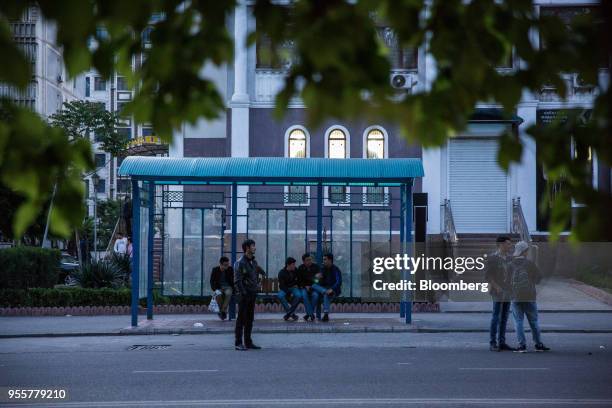 Passengers wait at a bus stop in Dushanbe, Tajikistan, on Saturday, April 21, 2018. Flung into independence after the Soviet Union collapsed in 1991,...