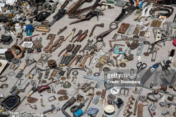 Various tools and components are displayed for sale at a stall of a market in Dushanbe, Tajikistan, on Sunday, April 22, 2018. Flung into...
