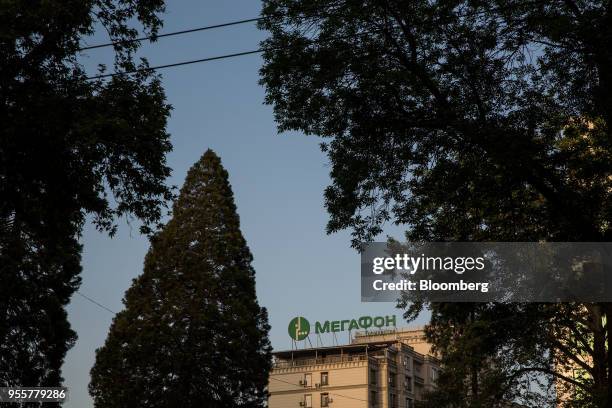 Signage for mobile provider MegaFon PJSC is displayed atop a building in Dushanbe, Tajikistan, on Sunday, April 22, 2018. Flung into independence...