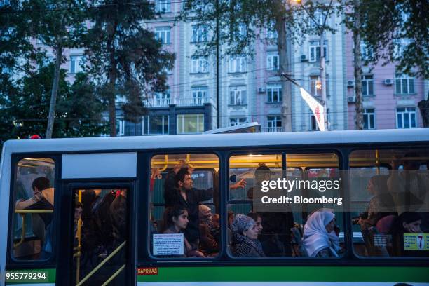 Passengers ride a bus in Dushanbe, Tajikistan, on Sunday, April 22, 2018. Flung into independence after the Soviet Union collapsed in 1991, the...