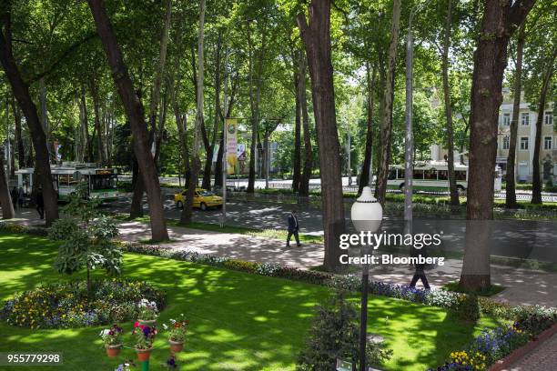 Pedestrians walk along Rudaki Avenue in Dushanbe, Tajikistan, on Sunday, April 22, 2018. Flung into independence after the Soviet Union collapsed in...