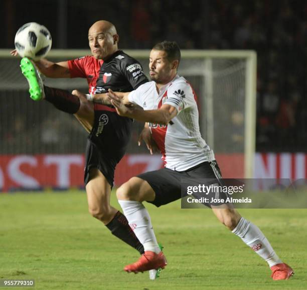 Clemente Rodriguez of Colon fights for the ball with Rodrigo Mora of River Plate during a match between Colon and River Plate as part of Superliga at...