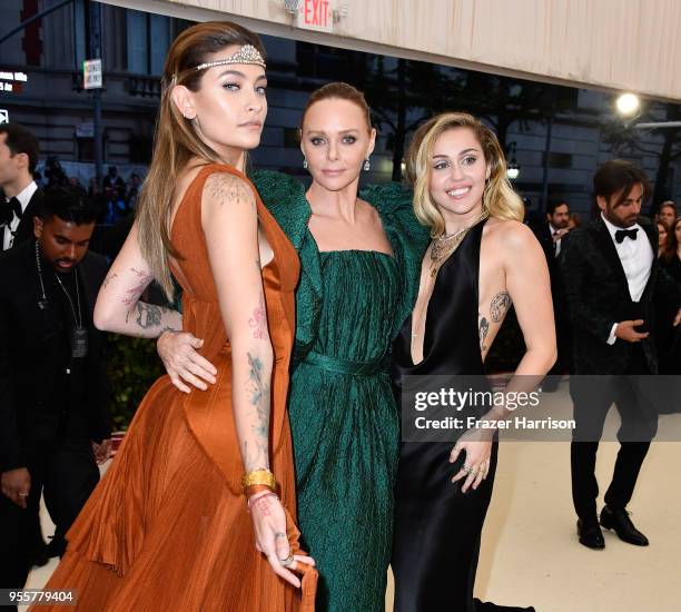 Paris Jackson, Stella McCartney and Miley Cyrus attend the Heavenly Bodies: Fashion & The Catholic Imagination Costume Institute Gala at The...