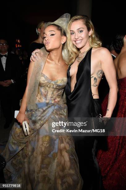 Ariana Grande and Miley Cyrus attend the Heavenly Bodies: Fashion & The Catholic Imagination Costume Institute Gala at The Metropolitan Museum of Art...
