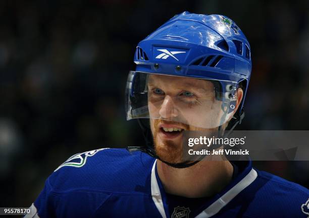 Daniel Sedin of the Vancouver Canucks looks on from the bench during their game against the Anaheim Ducks at General Motors Place on December 16,...