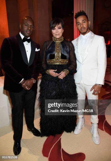 Corey Gamble, Kris Jenner, and Lewis Hamilton attend the Heavenly Bodies: Fashion & The Catholic Imagination Costume Institute Gala at The...