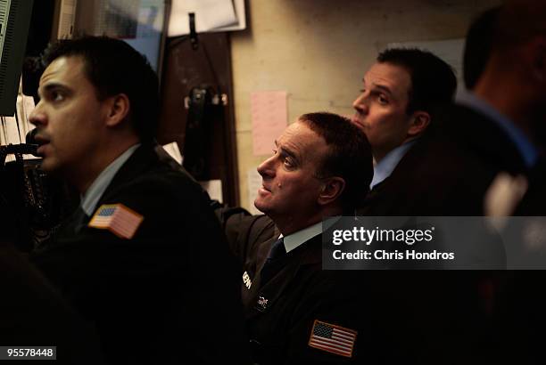 Financial professionals work on the floor of the New York Stock Exchange near the end of the trading day on January 4, 2010 in New York City. Stocks...