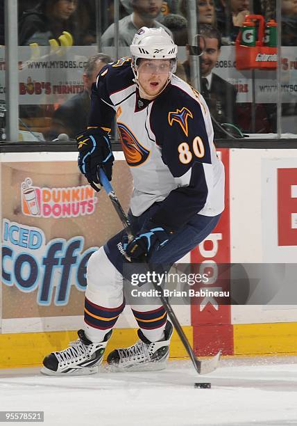 Nik Antropov of the Atlanta Thrashers skates with the puck against the Boston Bruins at the TD Garden on December 30, 2009 in Boston, Massachusetts.