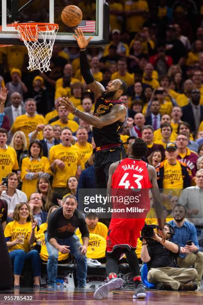 LeBron James of the Cleveland Cavaliers scores over Pascal Siakam of the Toronto Raptors during the first half of Game 4 of the second round of the...