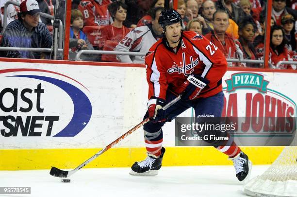 Mike Knuble of the Washington Capitals handles the puck against the Carolina Hurricanes at the Verizon Center on December 28, 2009 in Washington, DC.