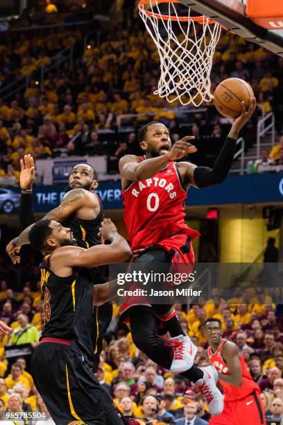 Miles of the Toronto Raptors goes up for a basket against Tristan Thompson and LeBron James of the Cleveland Cavaliers during the first half of Game...