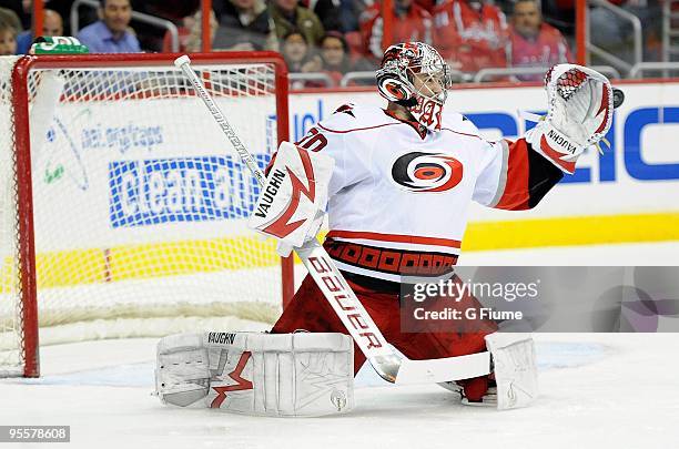 Cam Ward of the Carolina Hurricanes makes a save against the Washington Capitals at the Verizon Center on December 28, 2009 in Washington, DC.