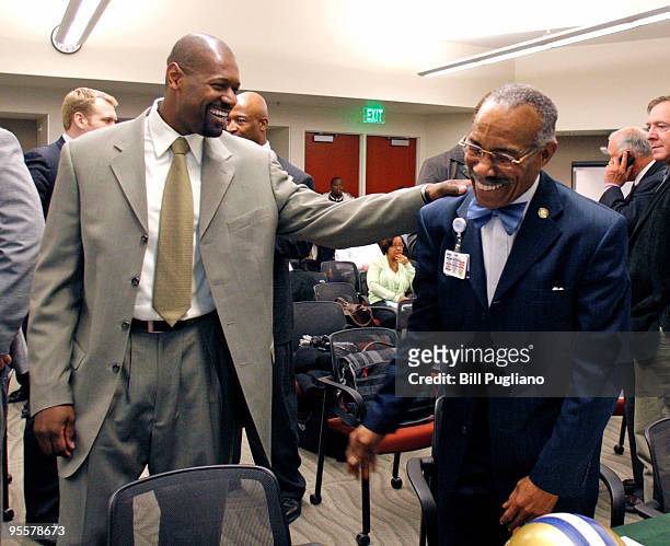 Lem Barney former Detroit Lions hall of fame player, jokes with former Detroit Lions wide receiver Herman Moore before speaking as a witness at a...
