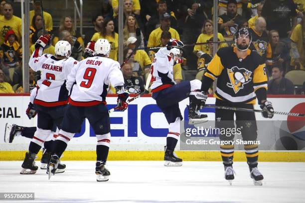 Evgeny Kuznetsov of the Washington Capitals celebrates his overtime winning goal to win the series against the Pittsburgh Penguins in Game Six of the...