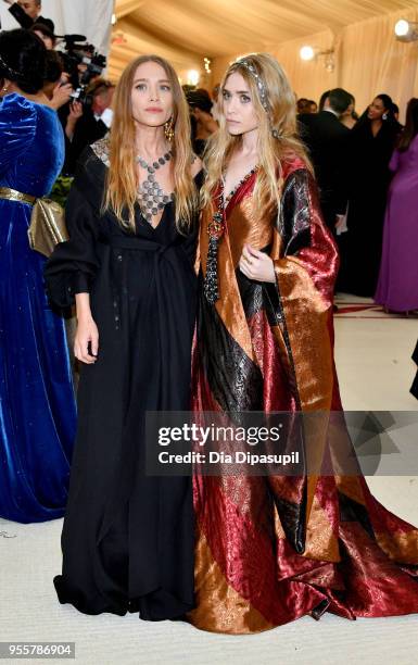 Mary-Kate Olsen and Ashley Olsen attend the Heavenly Bodies: Fashion & The Catholic Imagination Costume Institute Gala at The Metropolitan Museum of...