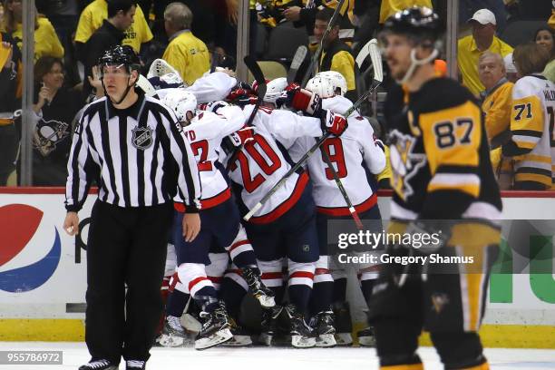 The Washington Capitals celebrate moving on to the Eastern Conference Finals after a 2-1 overtime win behind Sidney Crosby of the Pittsburgh Penguins...