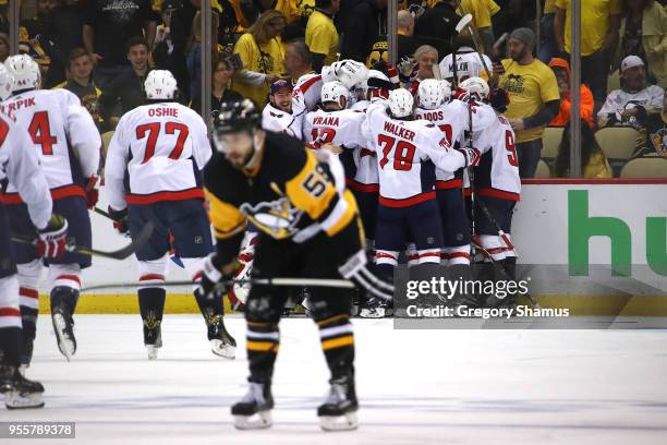 The Washington Capitals celebrate moving on to the Eastern Conference Finals after a 2-1 overtime win behind Kris Letang of the Pittsburgh Penguins...