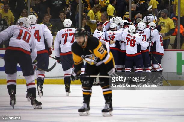 The Washington Capitals celebrate moving on to the Eastern Conference Finals after a 2-1 overtime win behind Kris Letang of the Pittsburgh Penguins...