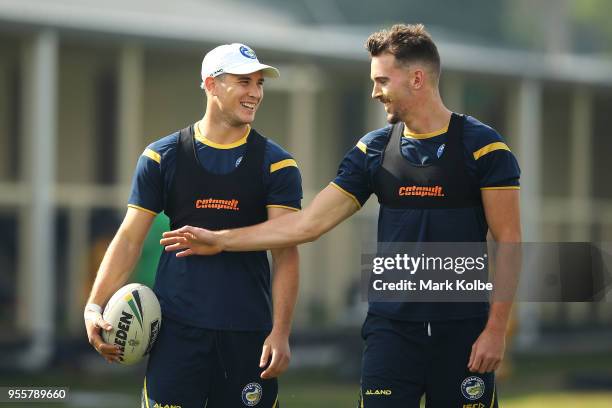 Mitchell Moses and Clint Gutherson speak as they warm-up ahead of a Parramatta Eels NRL training session at the Old Saleyards Reserve on May 8, 2018...