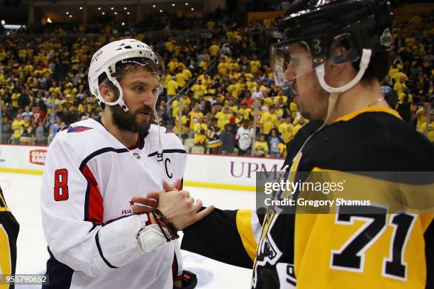 Alex Ovechkin of the Washington Capitals shakes hands with Evgeni Malkin of the Pittsburgh Penguins after a 4-2 Washington series win in the Eastern...