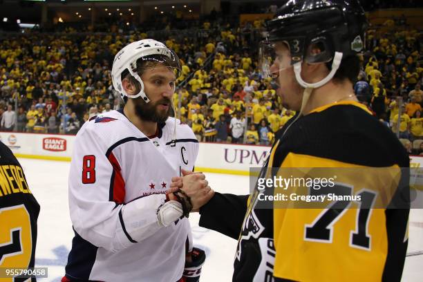 Alex Ovechkin of the Washington Capitals shakes hands with Evgeni Malkin of the Pittsburgh Penguins after a 4-2 Washington series win in the Eastern...
