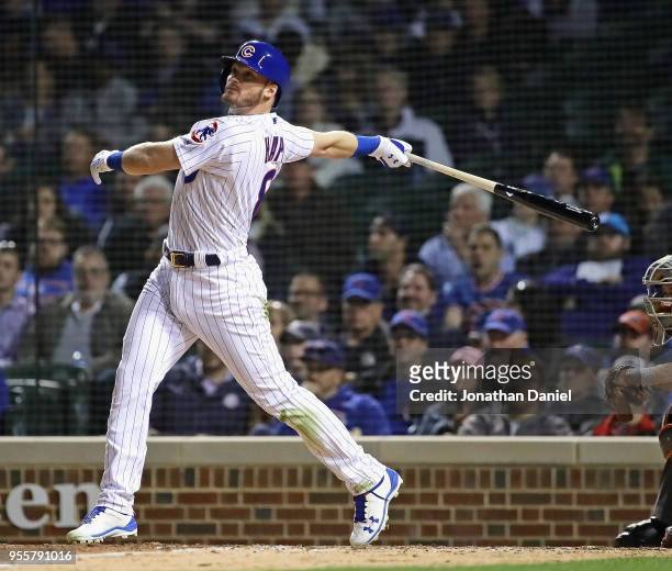 Ian Happ of the Chicago Cubs hits his second home run of the game, a three run shot in the 7th inning, against the Miami Marlins at Wrigley Field on...