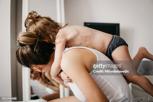 mother and daughter love - serious injury stock pictures, royalty-free photos & images