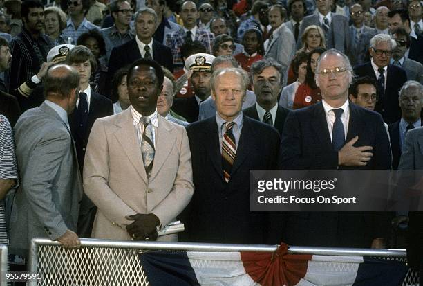 Baseball commissioner Bowie Kuhn , President Gerald Ford and Hank Aaron stand for the National Anthem before a 1982 World Series game between the St....
