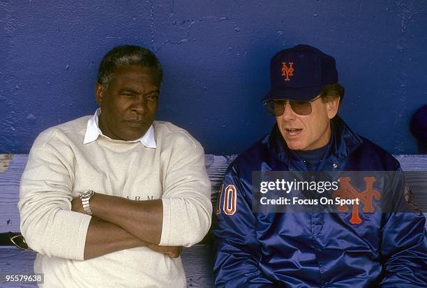National League President Bill White sits in the dougout talking with New York Mets Manager Jeff Torborg prior to the start of a Major League...