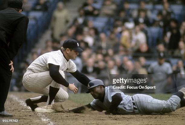 S: first baseman Mickey Mantle of the New York Yankees puts the tag on the Chicago White Sox runner diving back into first base during a circa 1960's...