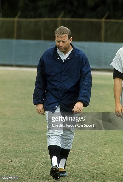Outfielder Mickey Mantle of the New York Yankees walking off the field after batting practice before a circa 1960's Major League Baseball game....