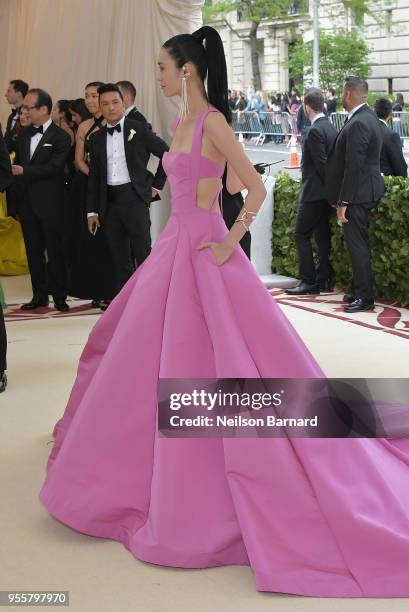 Ming Xi attends the Heavenly Bodies: Fashion & The Catholic Imagination Costume Institute Gala at The Metropolitan Museum of Art on May 7, 2018 in...