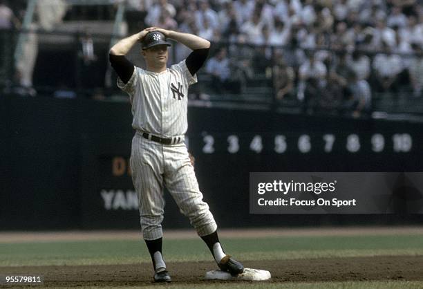 S: Outfielder Mickey Mantle of the New York Yankees is standing on second base during a circa 1960's Major League Baseball game at Yankee Stadium in...