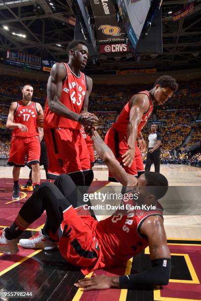 Pascal Siakam and Kyle Lowry help up CJ Miles of the Toronto Raptors in Game Four of the Eastern Conference Semifinals against the Cleveland...