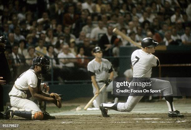 Outfielder Mickey Mantle of the New York Yankees swings and watches the flight of his ball during a circa 1960's Major League Baseball game. Mantle...