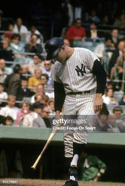 S: Outfielder Mickey Mantle of the New York Yankees at the plate knocking the dirt off his spikes with his bat during a circa 1960's Major League...