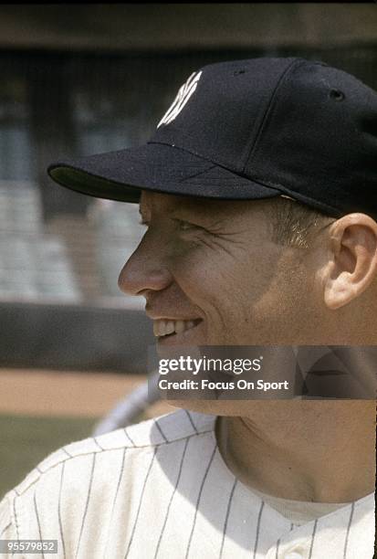 S: Outfielder Mickey Mantle of the New York Yankees standing, smiling waiting his turn to hit during batting practice before a circa 1960's Major...