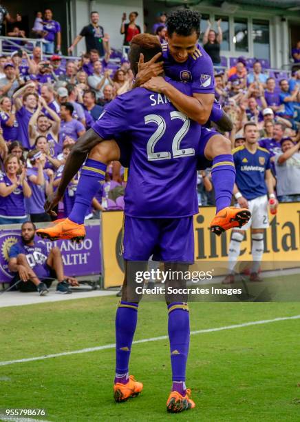 Lamine Sane of Orlando City celebrates 2-1 with Yoshimar Yotun of Orlando City during the match between Orlando City v Real Salt Lake on May 6, 2018